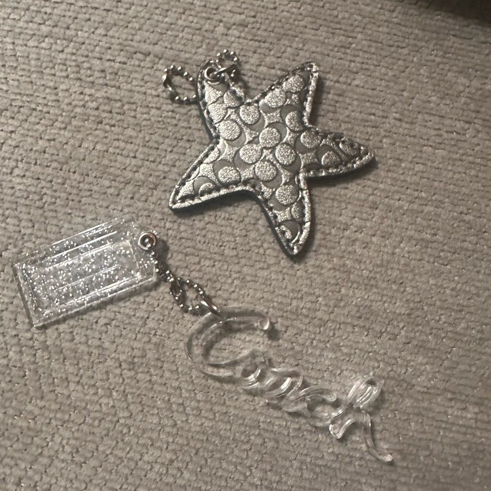 Coach Silver Star Keychain with Signature Pattern